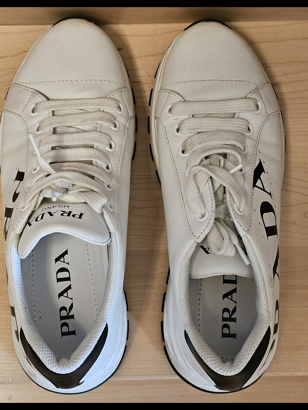 Prada White Leather Low-Top Sneakers with Black Logo
